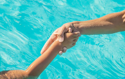 Low section of people on swimming pool