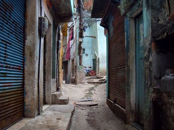 Alley amidst buildings in old house