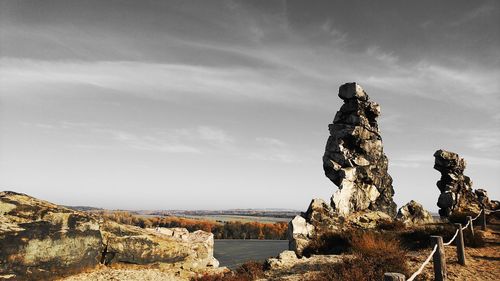 Rock formations on landscape against sky