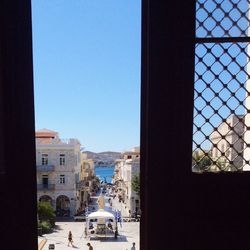 View of buildings against clear blue sky