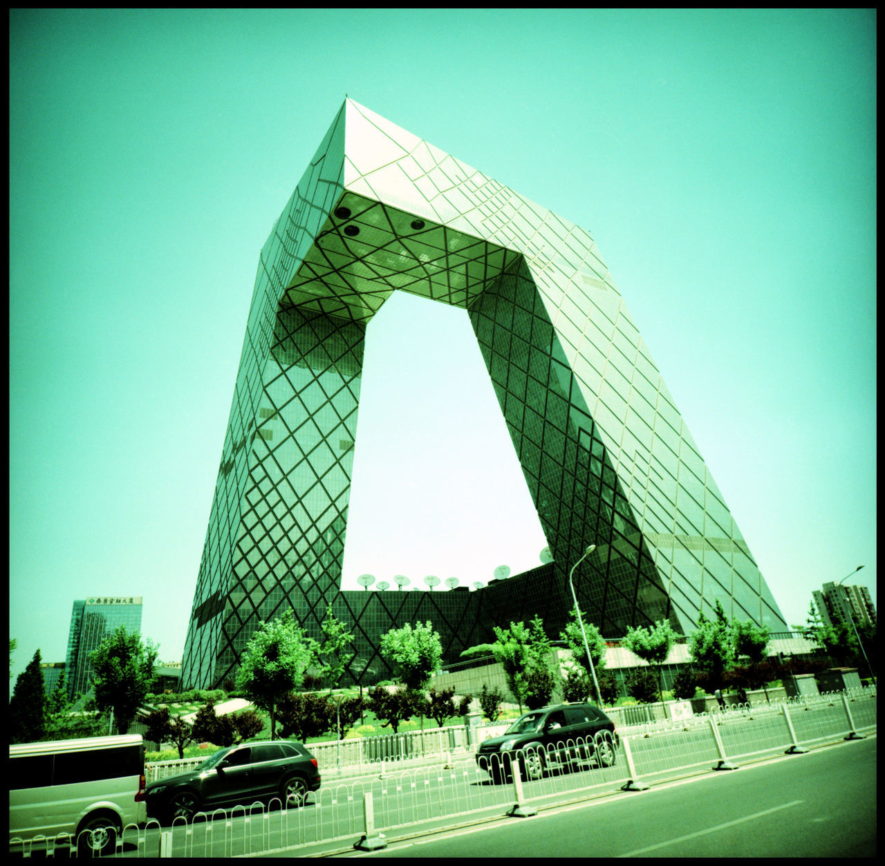 CCTV Tower Beijing by Rem Koolhaas Rem Koolhaas CCTV Tower Beijing CCTV Broadcasting Building Travel China Analogue Photography Xpro Architecture Outdoors Glas And Concrete Bold Architecture No People Urban Beijing Modern China Metropolis Broadcasting Tower Cctv Headquarters Booming China Beijing, China Beijing Architecture Unusual Architecture Power China Chinese TV Summer