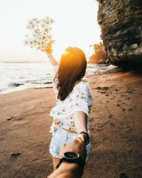 Rear view of woman on beach