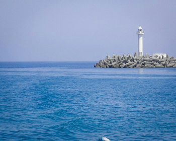 Scenic view of sea against blue sky