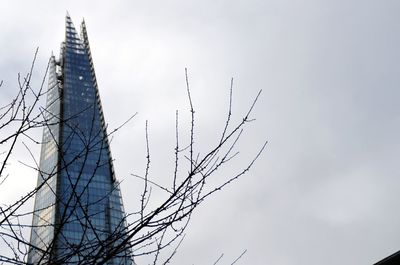 Low angle view of bare tree against sky