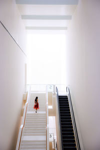 High angle view of woman walking on steps