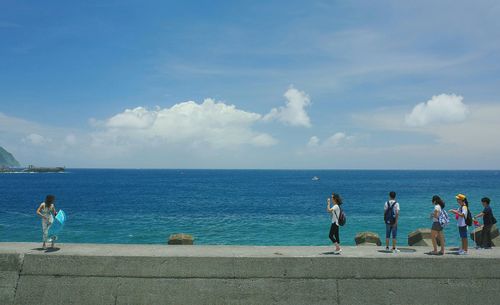 Scenic view of sea against cloudy sky