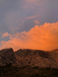 Scenic view of mountains against sky during sunset