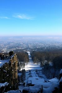 Aerial view of landscape against sky during winter