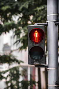 Red traffic light for pedestrians with copy space on the left