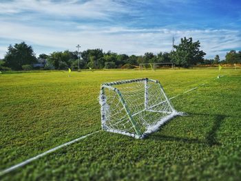 Scenic view of soccer field against sky