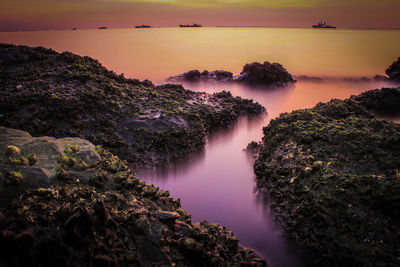 Scenic view of sea against sky during sunset