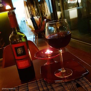 Glass of wine bottles on table in restaurant