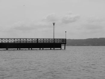 Pier over sea against sky