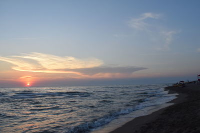 Scenic view of sea against cloudy sky