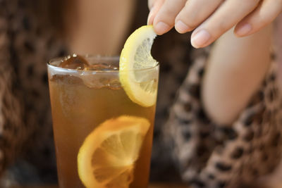 Close-up of hand holding drink