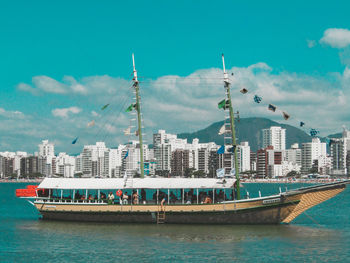 Panoramic view of sea and buildings against sky