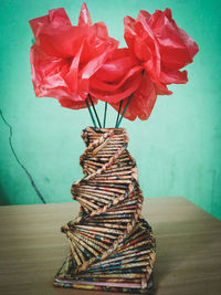 Close-up of red rose on table