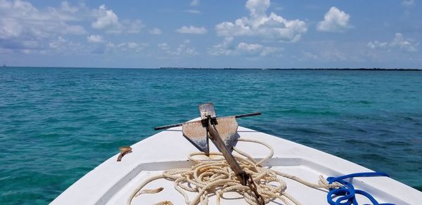 Boat sailing in sea against sky