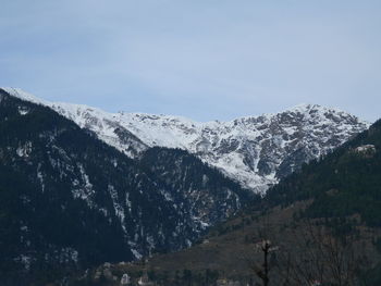 Scenic view of mountains against sky during winter