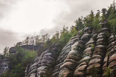 Low angle view of rock against sky