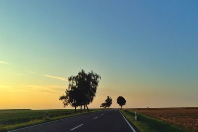 Country road passing through field