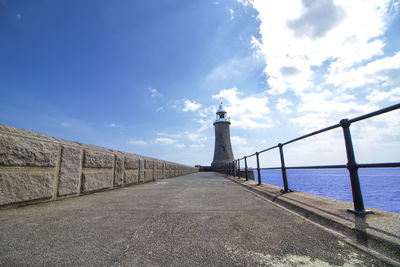 View of lighthouse against cloudy sky