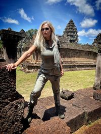 Rear view of woman standing on field