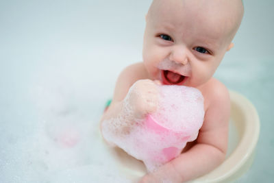 Baby bathes in the bathroom