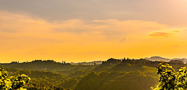Scenic view of landscape against sky during sunset