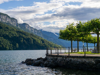 Scenic view of lake and mountains against sky