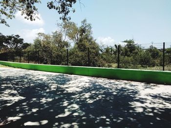 View of swimming pool in park against sky