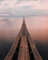 High angle view of bridge over sea during sunset