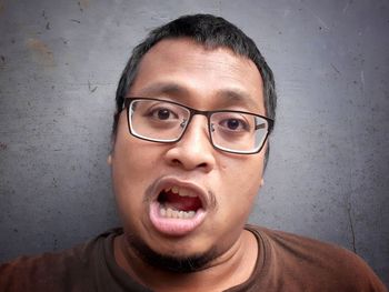 Portrait of young man wearing eyeglasses