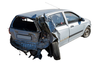 Damaged car against clear sky