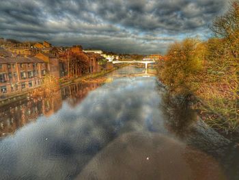 Reflection of sky on water in city