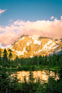 Scenic view of lake and mountains against sky