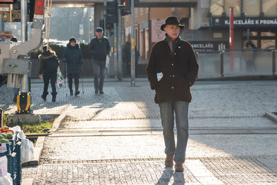 People walking on street in city