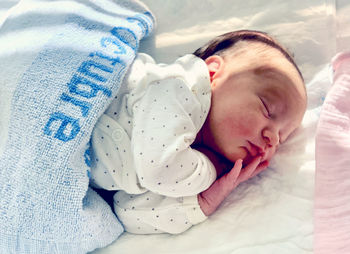 Cute baby sleeping in bed