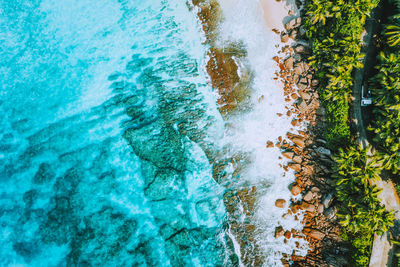 High angle view of rocks by sea