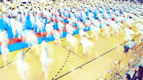 High angle view of people sitting on floor