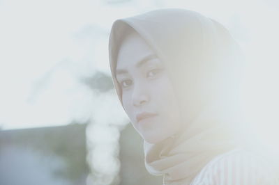 Side view of woman wearing hijab during sunset