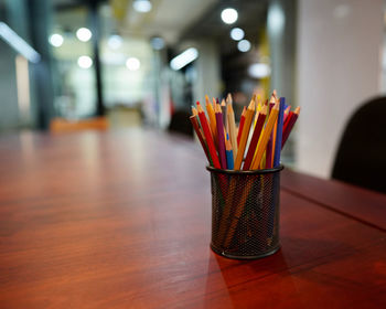 Close-up of colored pencils on table