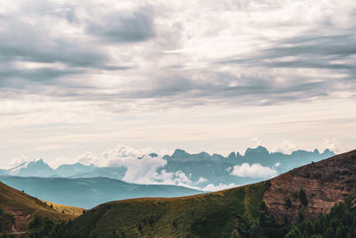 View of mountain range against cloudy sky