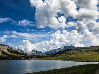 Scenic view of lake and mountains against sky