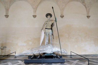 View of statue against ceiling of building