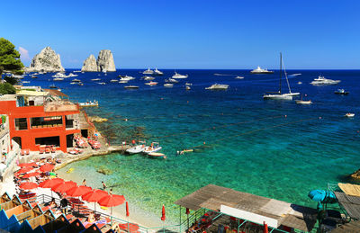 High angle view of sea against clear blue sky