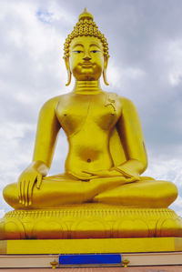 Low angle view of statue against sky