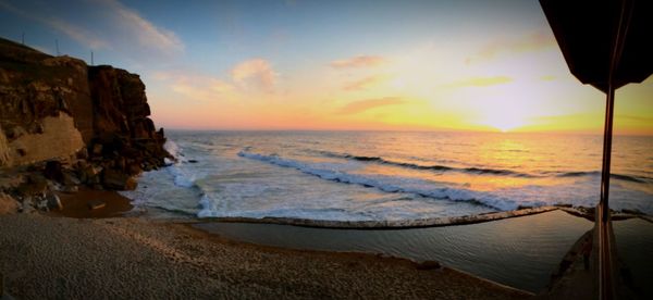 Scenic view of sea at sunset
