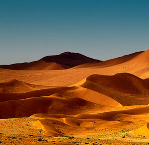 Scenic view of desert against clear sky