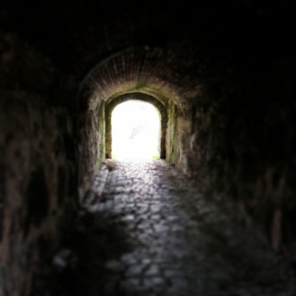 the way forward, arch, tunnel, indoors, diminishing perspective, architecture, built structure, archway, corridor, light at the end of the tunnel, vanishing point, narrow, wall - building feature, illuminated, old, walkway, dark, wall, day, long